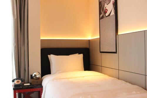 Imagen de la habitación del Hotel Moxy Chongqing. Foto 13