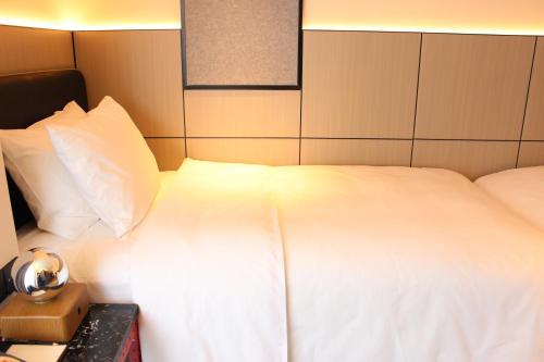 Imagen de la habitación del Hotel Moxy Chongqing. Foto 14