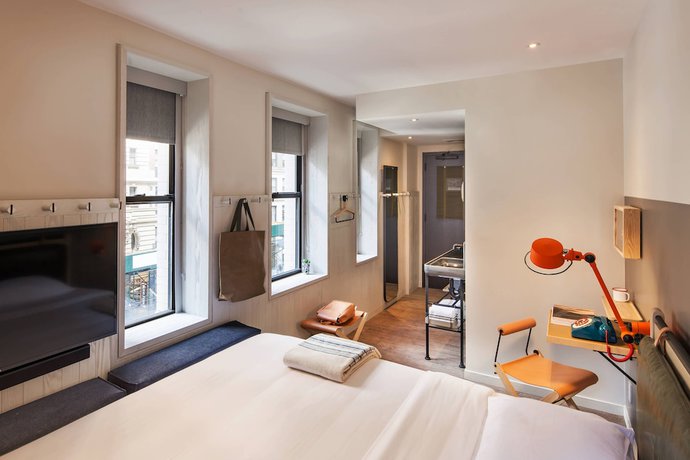 Imagen de la habitación del Hotel Moxy Nyc Times Square. Foto 10