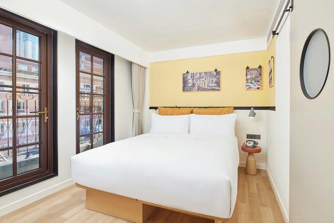 Imagen de la habitación del Hotel Moxy Shanghai Putuo. Foto 10