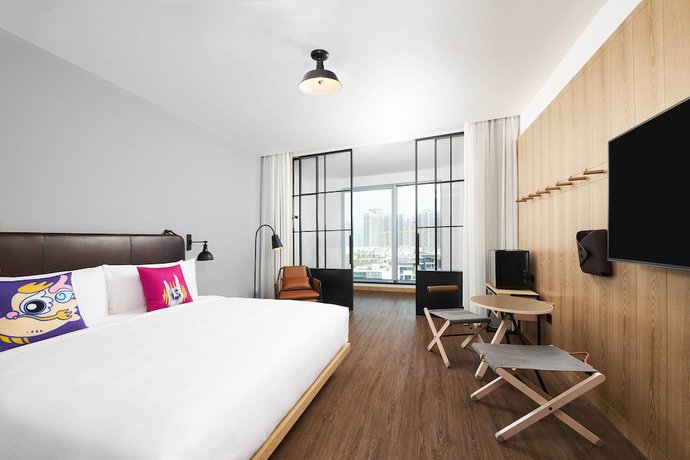 Imagen de la habitación del Hotel Moxy Shenzhen North Station. Foto 9