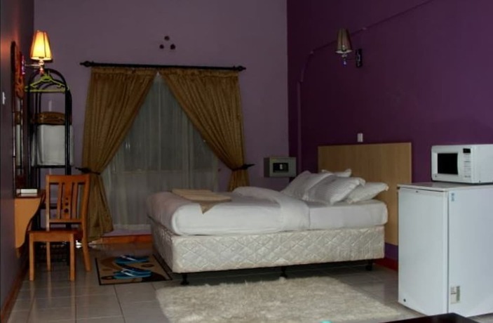 Imagen de la habitación del Hotel Mpeta House. Foto 18