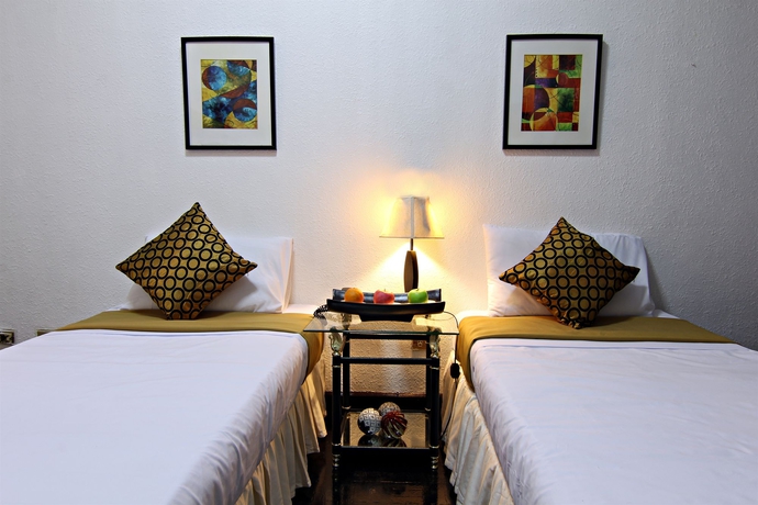 Imagen de la habitación del Hotel Mpt Suites. Foto 6