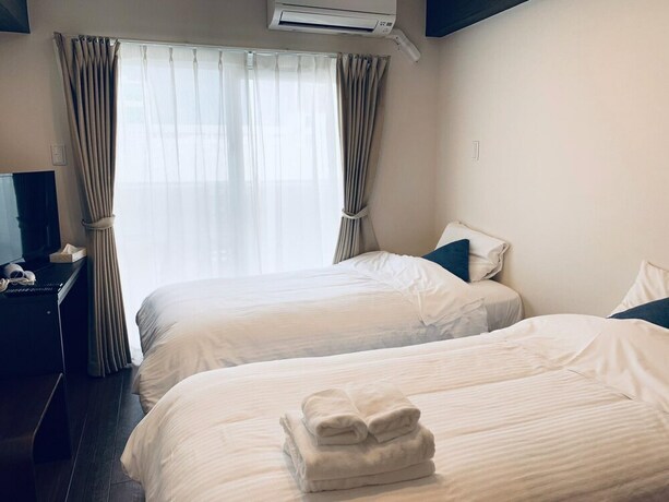 Imagen de la habitación del Hotel Mr. Kinjo Satomo In Ginowan. Foto 19