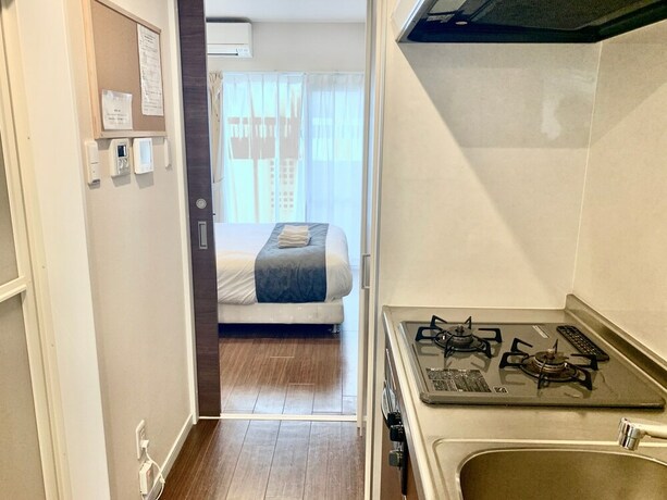 Imagen de la habitación del Hotel Mr. Kinjo Satomo In Ginowan. Foto 21