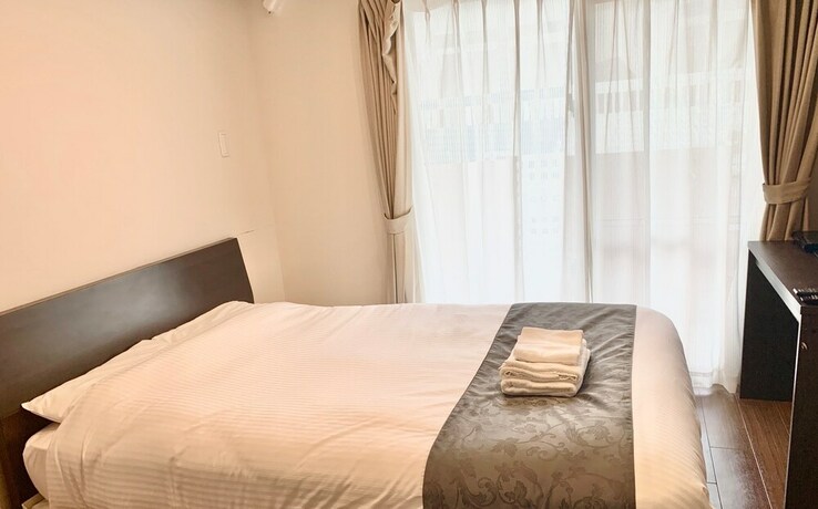 Imagen de la habitación del Hotel Mr. Kinjo Satomo In Ginowan. Foto 32