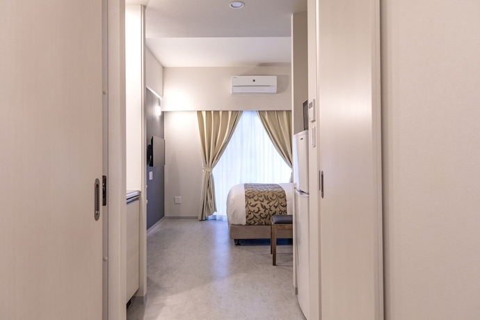 Imagen de la habitación del Hotel Mr.kinjo Eminence Inn Makishi. Foto 8