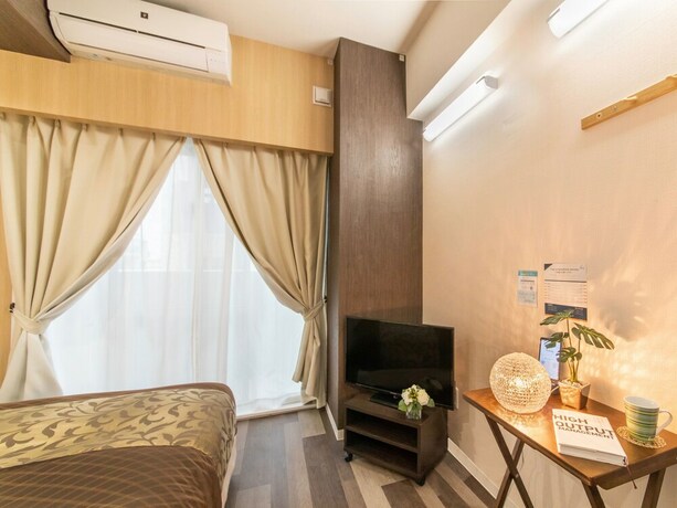 Imagen de la habitación del Hotel Mr.kinjo In Uchidomari. Foto 31