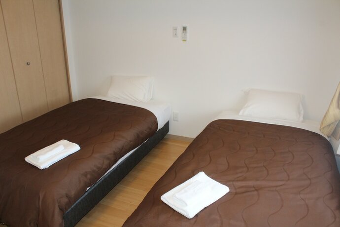 Imagen de la habitación del Hotel M's Stay Okinawa. Foto 17