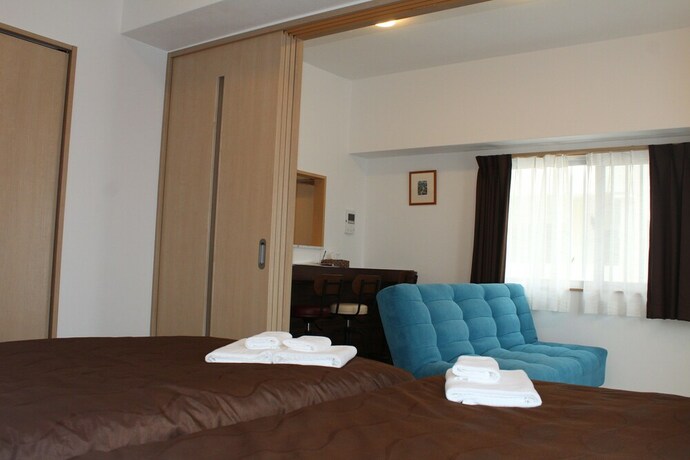 Imagen de la habitación del Hotel M's Stay Okinawa. Foto 22