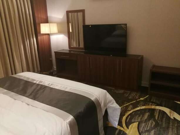 Imagen de la habitación del Hotel Msharef Al Moden Suites. Foto 15