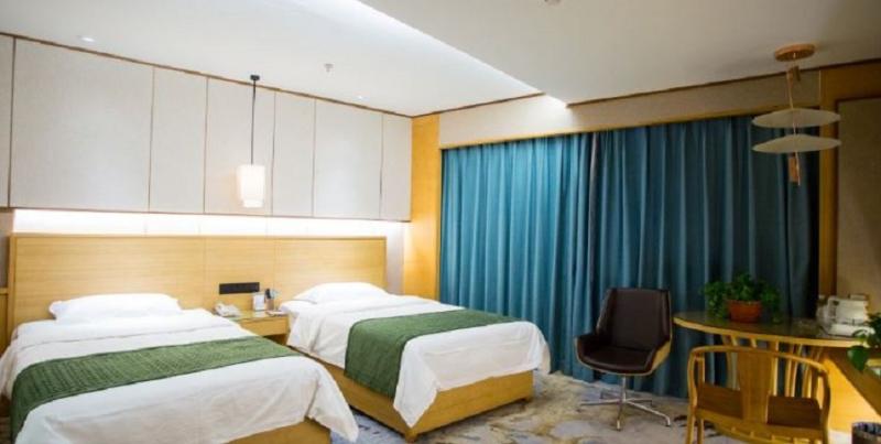 Imagen de la habitación del Hotel Mu Dan Jiang Oriental Pearl International Hotel. Foto 4