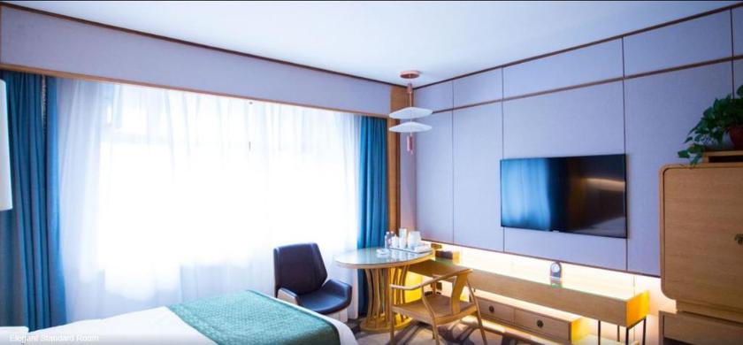 Imagen de la habitación del Hotel Mu Dan Jiang Oriental Pearl International Hotel. Foto 14