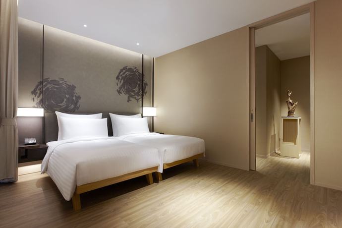 Imagen de la habitación del Hotel Mu Jiao Xi. Foto 6