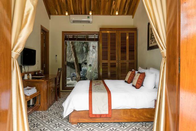 Imagen de la habitación del Hotel Mua Caves Ecolodge. Foto 15