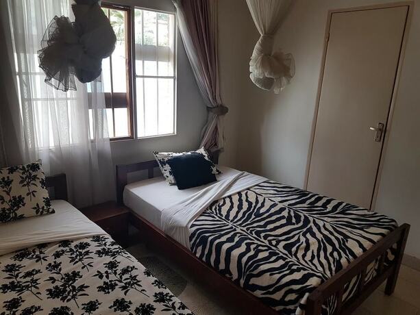 Imagen de la habitación del Hotel Mubwiza Courts. Foto 16