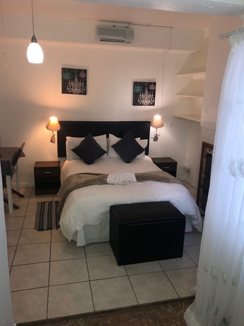 Imagen de la habitación del Hotel Muco Guest House. Foto 13