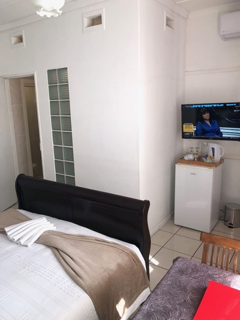 Imagen de la habitación del Hotel Muco Guest House. Foto 16