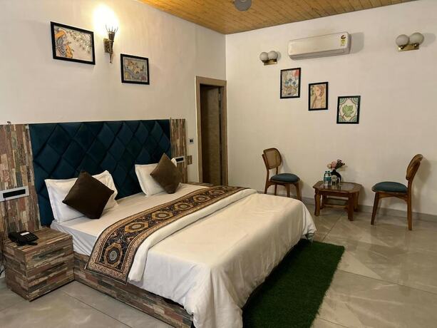 Imagen de la habitación del Hotel Mudras Grove Resort. Foto 11