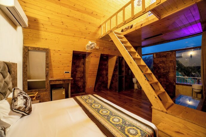 Imagen de la habitación del Hotel Mudras Grove Resort. Foto 13