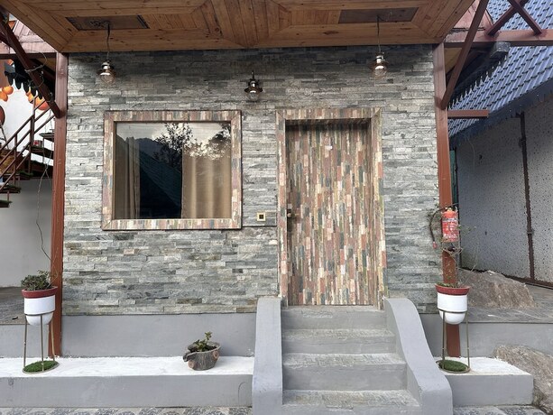 Imagen de la habitación del Hotel Mudras Grove Resort. Foto 19
