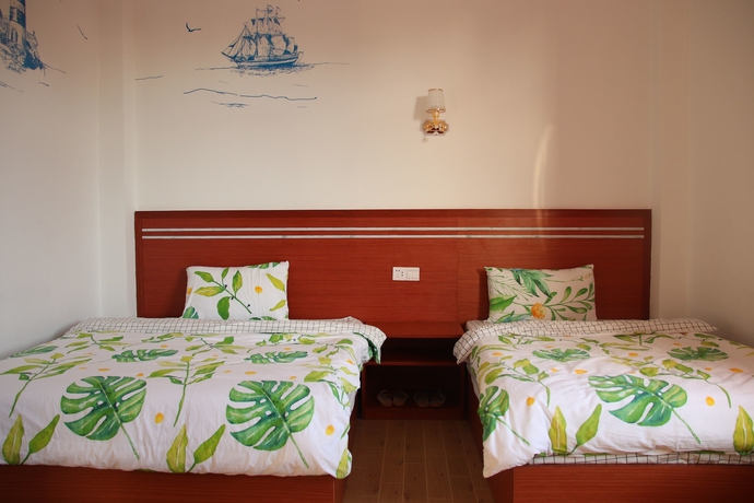 Imagen de la habitación del Hotel Muhai Guesthouse. Foto 3