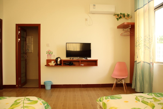 Imagen de la habitación del Hotel Muhai Guesthouse. Foto 4