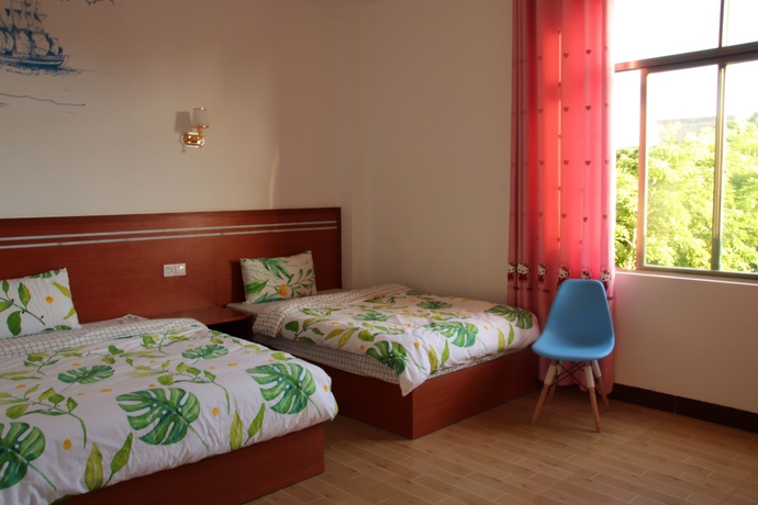 Imagen de la habitación del Hotel Muhai Guesthouse. Foto 5