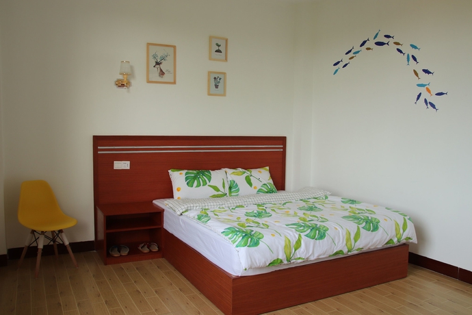 Imagen de la habitación del Hotel Muhai Guesthouse. Foto 10