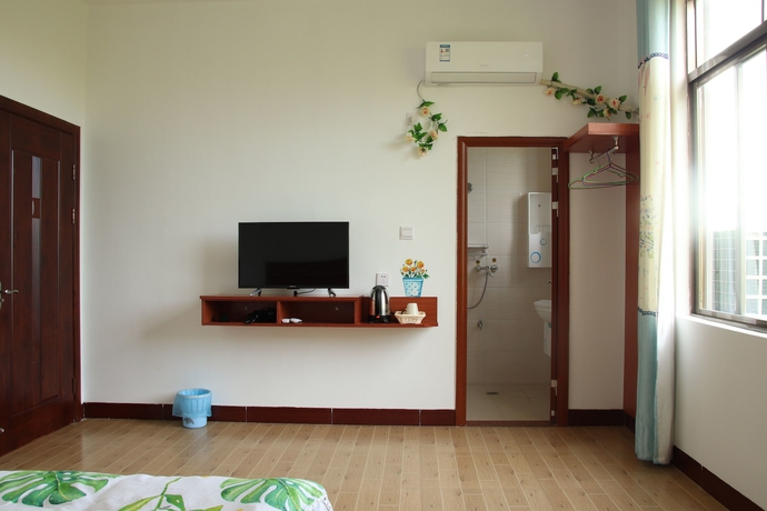 Imagen de la habitación del Hotel Muhai Guesthouse. Foto 11