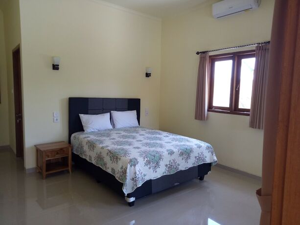 Imagen de la habitación del Hotel Mulia Home Stay. Foto 18