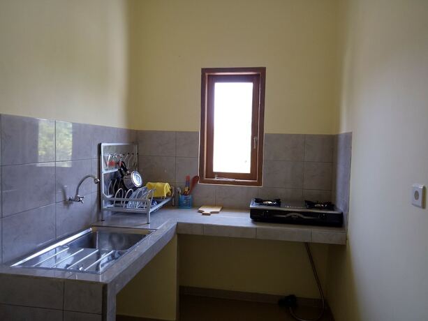 Imagen de la habitación del Hotel Mulia Home Stay. Foto 19