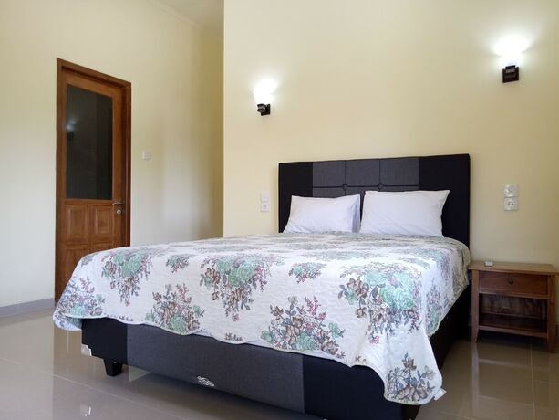 Imagen de la habitación del Hotel Mulia Home Stay. Foto 24