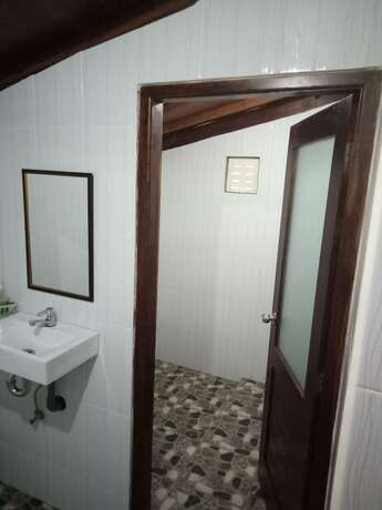 Imagen de la habitación del Hotel Mulia Home Stay. Foto 25