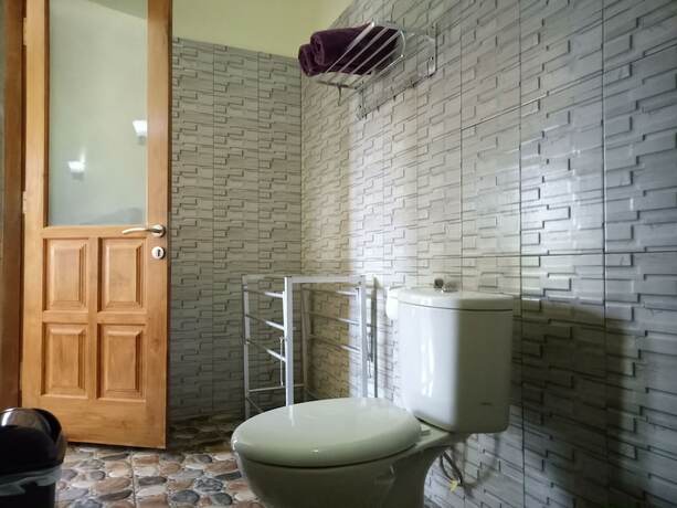 Imagen de la habitación del Hotel Mulia Home Stay. Foto 26