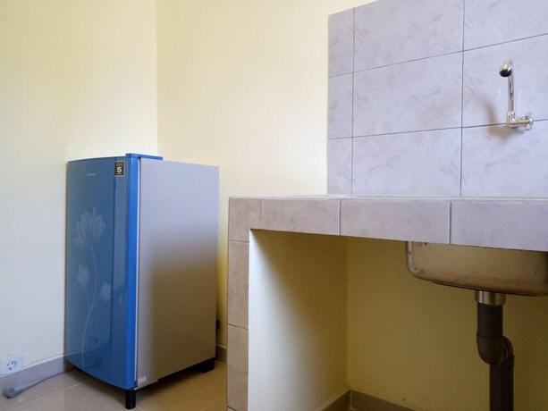 Imagen de la habitación del Hotel Mulia Home Stay. Foto 27