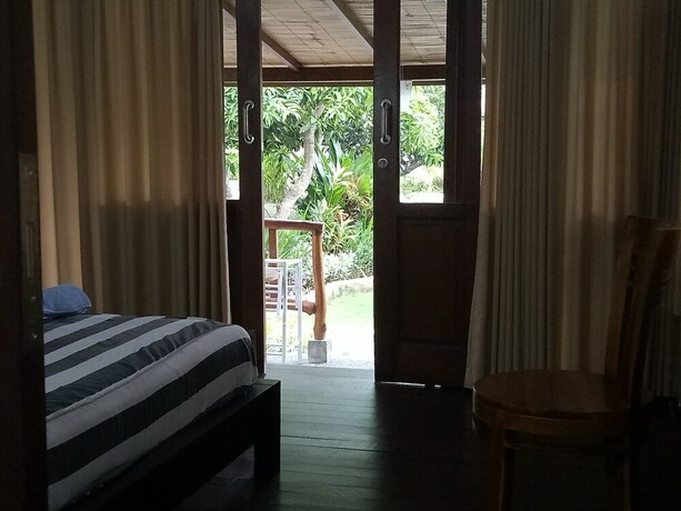 Imagen de la habitación del Hotel Mulia Home Stay. Foto 29