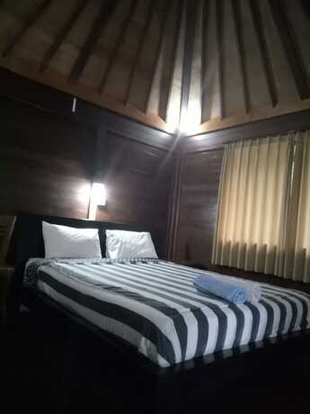 Imagen de la habitación del Hotel Mulia Home Stay. Foto 31