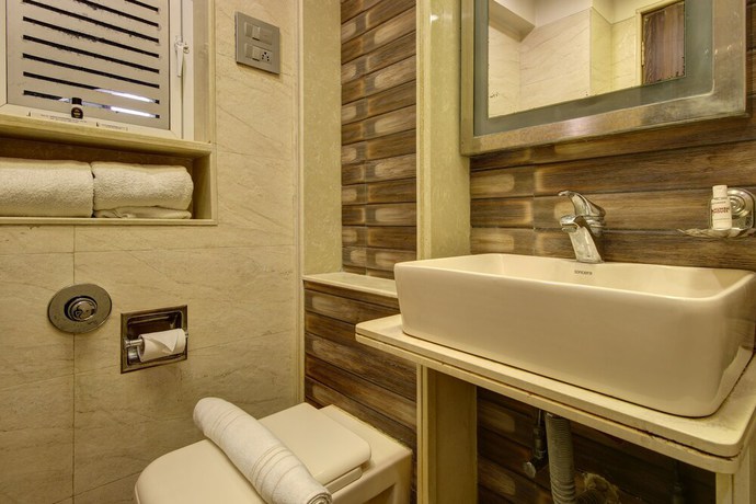 Imagen de la habitación del Hotel Mumbai House Juhu. Foto 12
