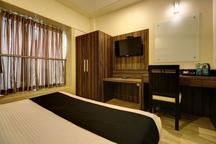 Imagen de la habitación del Hotel Mumbai House Juhu. Foto 15