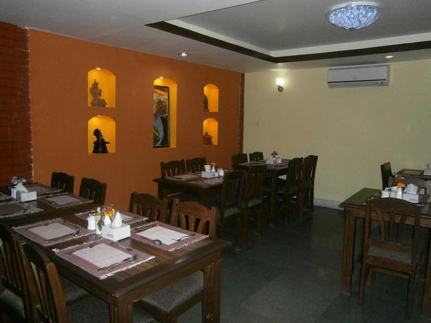 Imagen del bar/restaurante del Hotel Mums Home. Foto 2