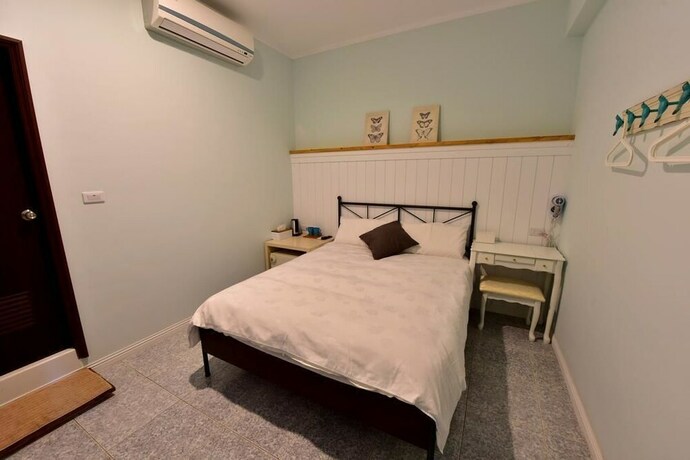 Imagen de la habitación del Hotel Mumu Inn. Foto 14