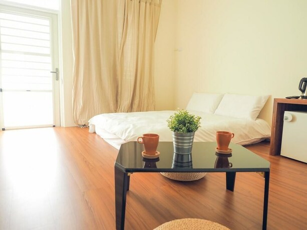 Imagen de la habitación del Hotel Mumu Inn. Foto 19