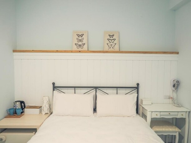 Imagen de la habitación del Hotel Mumu Inn. Foto 30