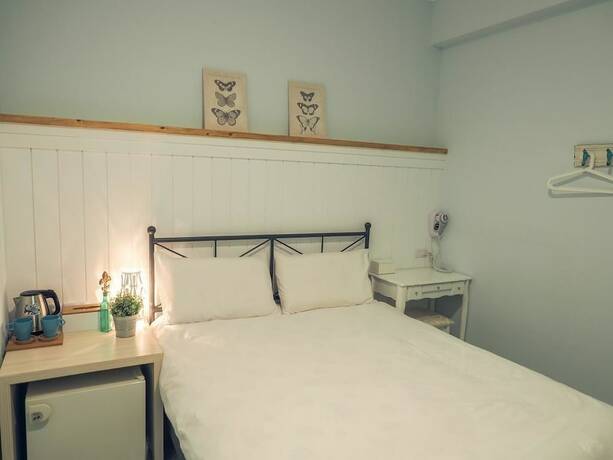 Imagen de la habitación del Hotel Mumu Inn. Foto 31