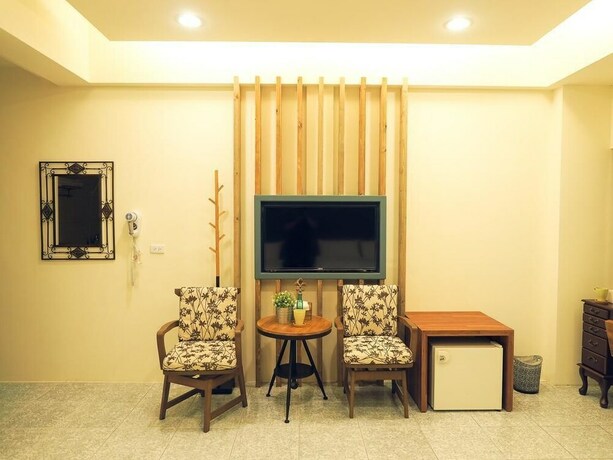 Imagen de la habitación del Hotel Mumu Inn. Foto 34