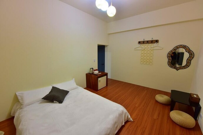 Imagen de la habitación del Hotel Mumu Inn. Foto 38