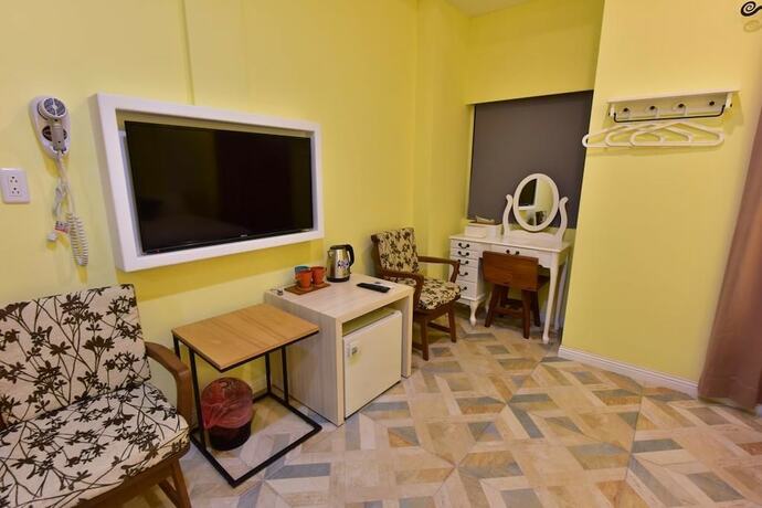 Imagen de la habitación del Hotel Mumu Inn. Foto 39