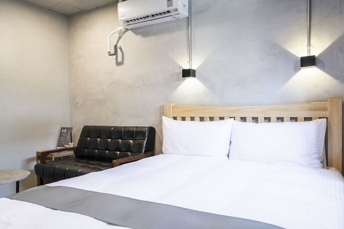 Imagen de la habitación del Hotel Munihey Inn. Foto 37