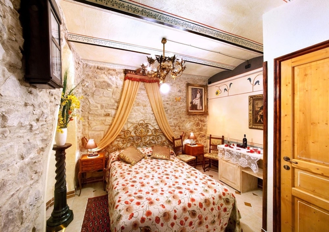 Imagen de la habitación del Hotel Munta e Cara Albergo Diffuso. Foto 16